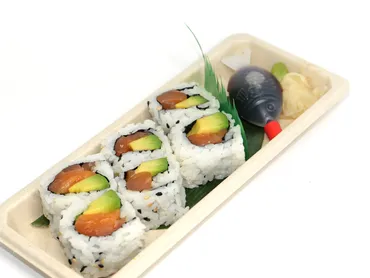 Salmon avocado roll served with wasabi and pickled ginger